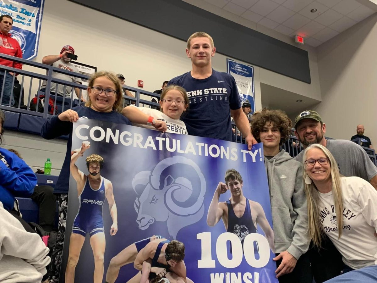 Ty+Watson+and+his+family+after+he+reached+100+wins.+