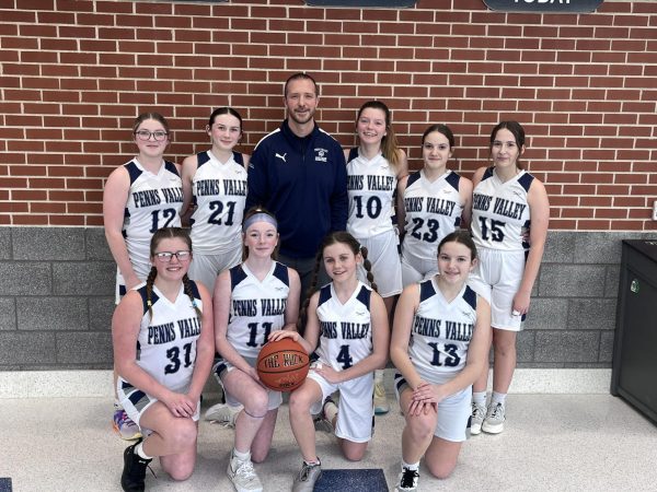 Junior High 8th Grade Girls with Coach Troxell-Family on three, 1, 2, 3, family!