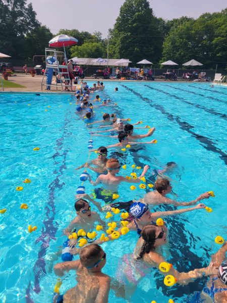 Pictured above is a Friday practice. We play relay games like this game where we attempt to get a rubber duck to the other side of the pool without putting it underwater.